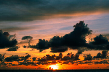 Beautiful motion blur long exposure sunset or sunrise with dramatic sky clouds over calm sea in tropical phuket island Amazing nature view and light of nature seascape