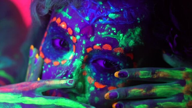 Ultraviolet neon portrait, glowing lines and bones, day of the dead, abstract fashion background with mexican hispanic girl, violet neon lights.