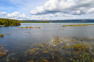 Sunny scenic landscape view of the entrance from the Brooks River into Naknek Lake, Katmai National Park, Alaska
