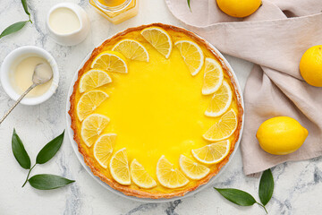 Plate with tasty lemon pie on light background