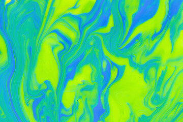 Attractive bright marble gradient, abstract background mixed yellow, green and blue nail polish, colorful surface