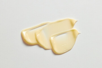 yellow cream wave in white background for cosmetic advertising