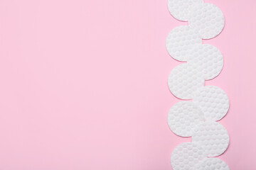 Clean soft cotton pads on pink background