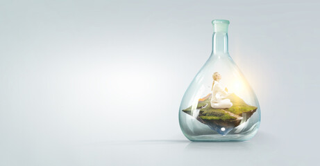 Business woman doing yoga in lotus pose inside glass bottle
