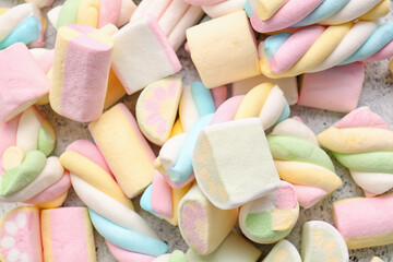 Different tasty pastille marshmallows on light background, closeup