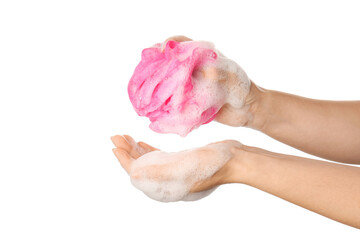 Woman holding pink bath sponge with foam against white background, closeup
