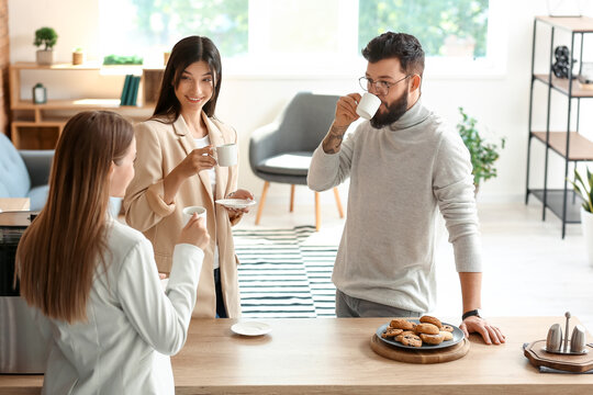 People Having Coffee Break In Office