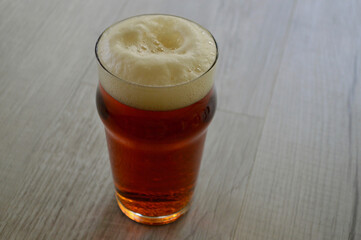 A glass of amber ale on the table