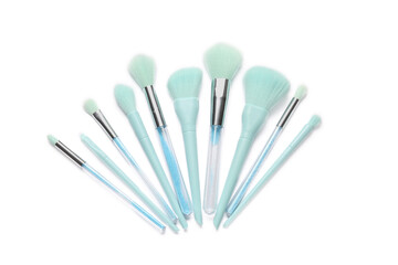 Different stylish makeup brushes on white background