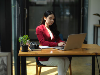 Elegance business female entrepreneur working in her office,