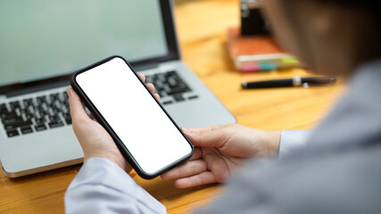 Close-up Female assistant using modern smart mobile phone