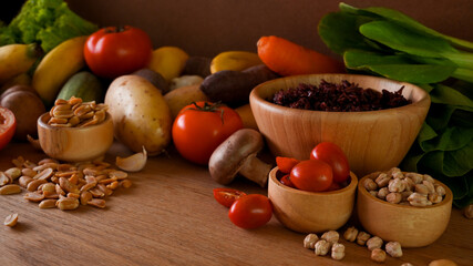 Various healthy raw organic vegetables for vegetarian, rice berry, nuts, vegetables.