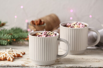 Cups of delicious hot chocolate on table