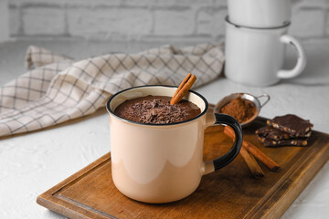 Mug of delicious hot chocolate on table