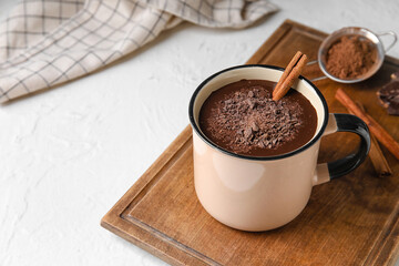 Mug of tasty hot chocolate on white background