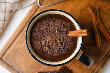 Mug of delicious hot chocolate on table