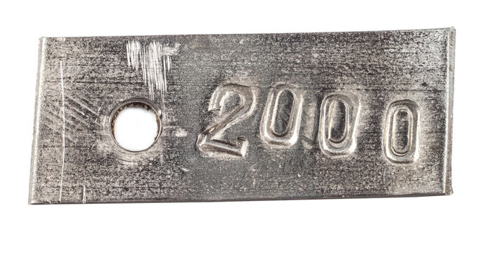 Metal tag with number 2000.