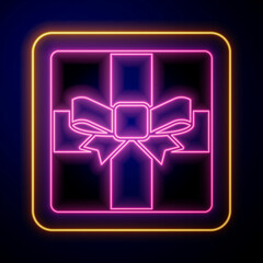 Glowing neon Gift box icon isolated on black background. Merry Christmas and Happy New Year. Vector