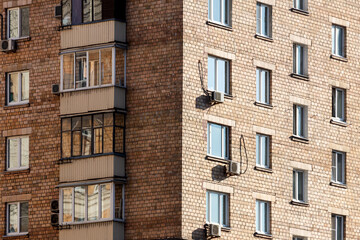 Close-up of a multi-apartment panel house with air conditioning
