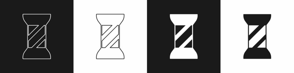 Set Sewing thread on spool icon isolated on black and white background. Yarn spool. Thread bobbin. Vector