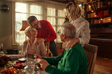 Young adult and senior couple during Christmastime