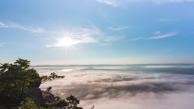 Zoom in Timelapse sunrise and clouds flowing over the mountain. Khao Phra Ya Dern Thong View Point, Lop Buri, Thailand
