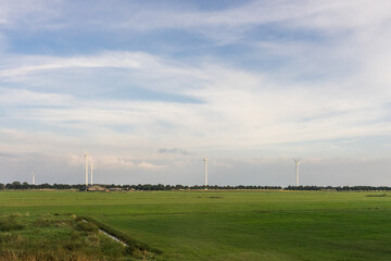 Antwerp, Belgium, a large green field windmills