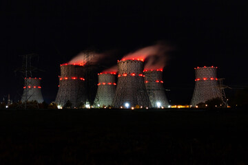 The cooling towers of the nuclear power plant at night