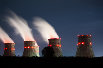 The cooling towers of the nuclear power plant at night