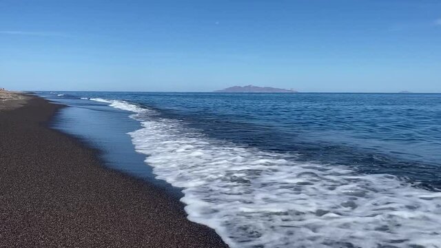 Beautiful Vichada Black Sand Beach in Santorini, Greece on a Sunny Day