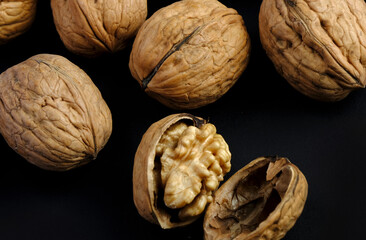 walnuts (akhrot) on black background, Dry fruits, walnut or akhrot well known dried fruit having shape like brain.