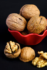 walnuts (akhrot) on black background, Dry fruits, walnut or akhrot well known dried fruit having shape like brain.