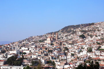 Fototapeta na wymiar View on Taxco de Alarcon city and Santa Prisca Parish Church, Mexico