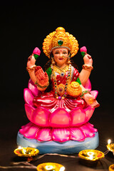 Beautiful Clay Idol of Hindu Goddess Lakshmi for diwali festival.