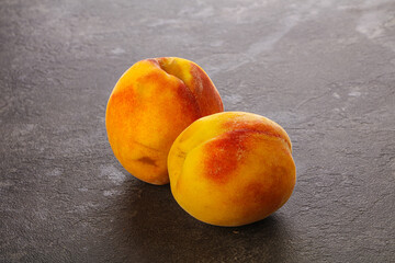 Two Sweet ripe tasty peaches