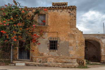 Typical rural house of the island of Mallorca, made of stone and in a state of abandonment. Image of the abandonment of the rural world