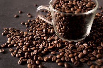Coffee beans against dark background. Selective focus.