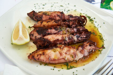 squid dish with lemon ready to eat