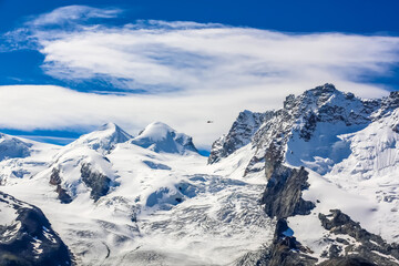 Fototapeta na wymiar Mountaineerin, Breithorn, West Alps, Swiss. Monte Rosa peaks. 