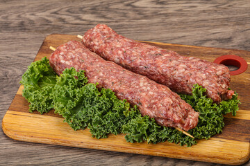 Raw minced beef kebab skewer