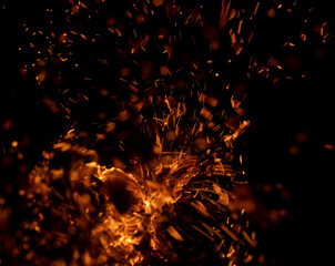 Fototapeta na wymiar flame fire with sparks on black background