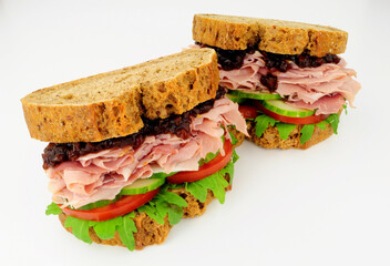 Ham and salad sandwiches In crusty brown bread slices with pickle relish