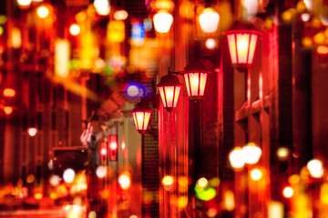 Street lights - Red light district in Amsterdam at night. Background. Selective focus on one lamp...