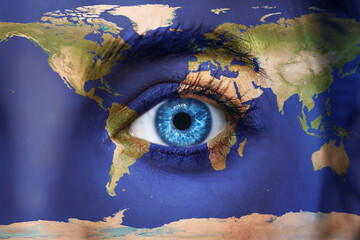Planet earth and blue human eye - Elements of this image furnished by NASA