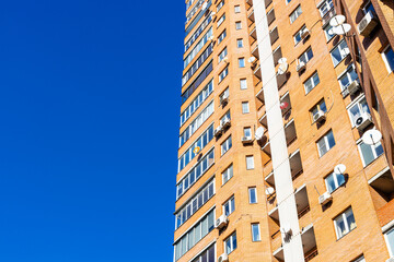 high-rise apartment house and blue sky on sunny day