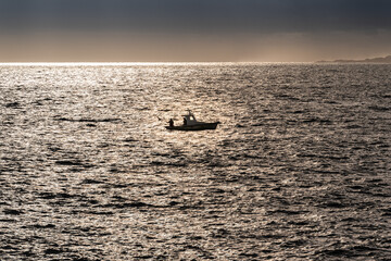 fishing boat on a silver sea in spain
