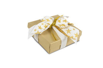 Gold luxury gift box decorated with gold stars on white ribbon. Festively wrapped Christmas gift isolated on white background.