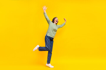 Fototapeta na wymiar Full length body size view of attractive cheerful carefree middle-aged woman dancing fooling isolated over shine yellow color background