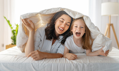 girl and her mother enjoying sunny morning