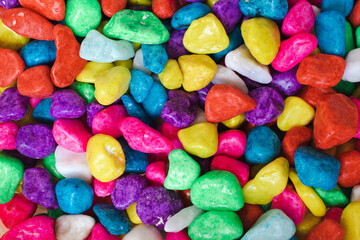 Bright colored pebbles background close-up beautiful abstract